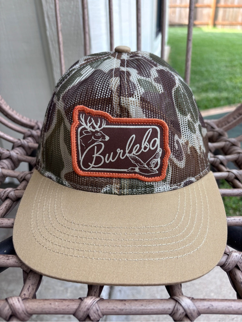BURLEBO Camo Mesh Trucker Hat with Orange-Trim Patch and Khaki Bill